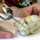 Drilling a Diprotodon incisor tooth for the study. (Image: Gilbert Price)